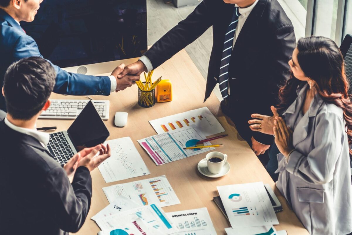 Four people around a business table