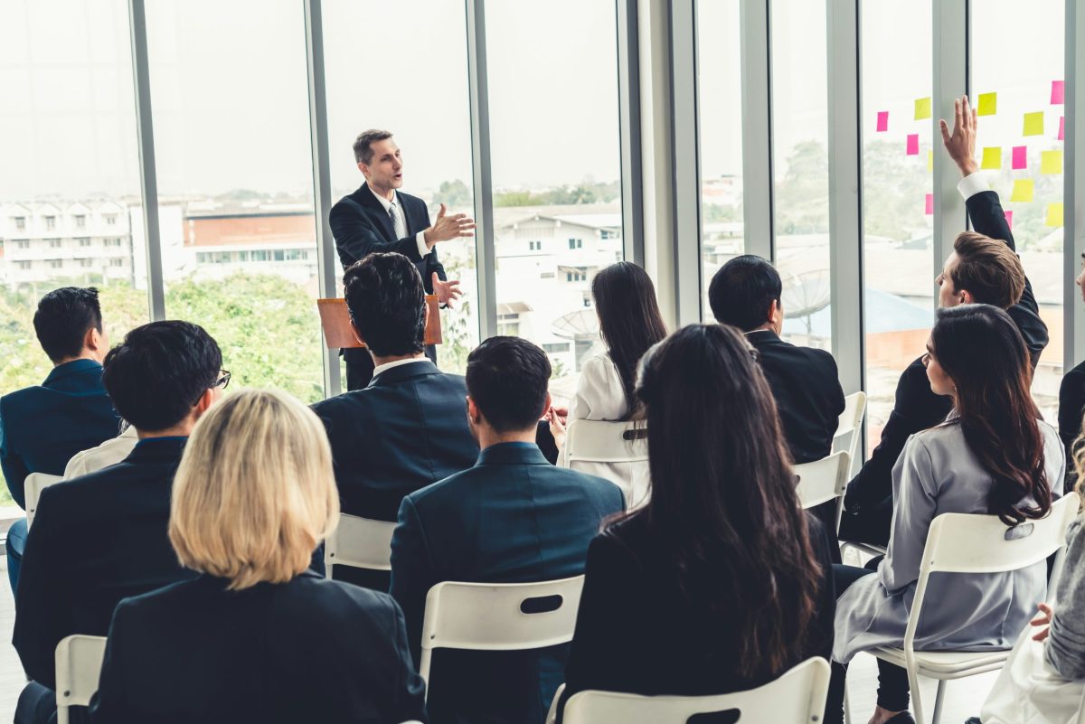 https://unsplash.com/photos/group-of-business-people-meeting-in-a-seminar-conference-audience-listening-to-instructor-in-employee-education-training-session-office-worker-community-summit-forum-with-expert-speaker-ZyvIhwzZpLU