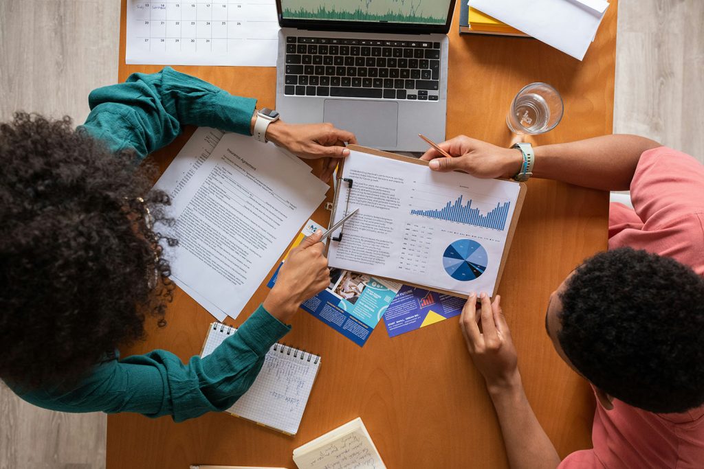 Two people study a chart